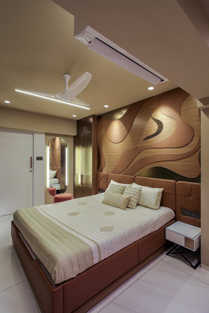 contact-img Elegant hotel bedroom with a stylish wood panel design and modern furnishings.